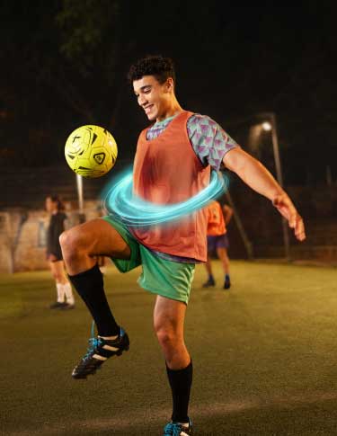 Image of a male ulcerative colitis (UC) TREMFYA® patient playing soccer with passion