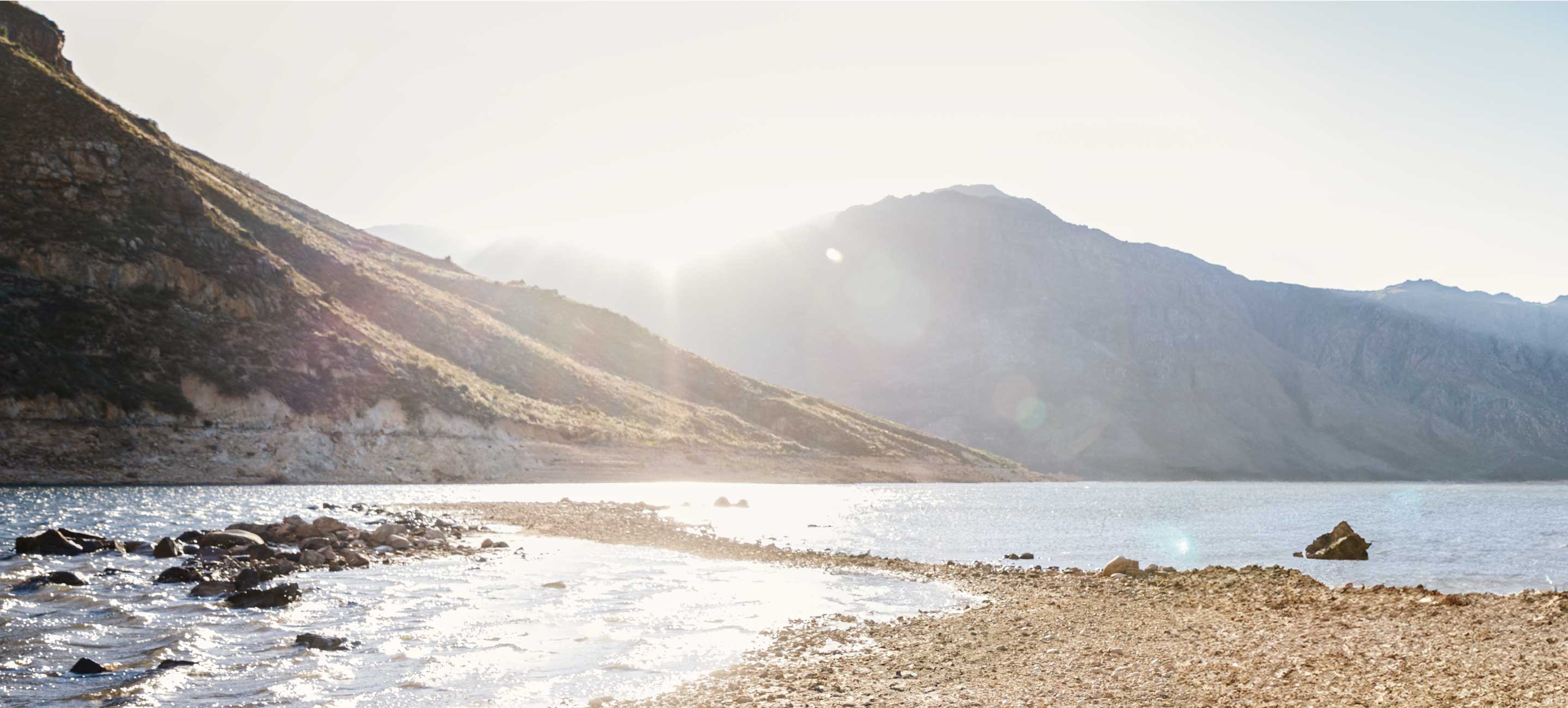 Background image of mountains and a river